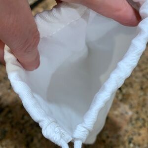 Authentic brand new Dior pouch with strings, must have for collectors/travellers